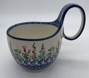 Waterscoop gekleurde wilde bloemen